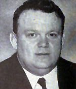 A person in a suit and tie

AI-generated content may be incorrect.