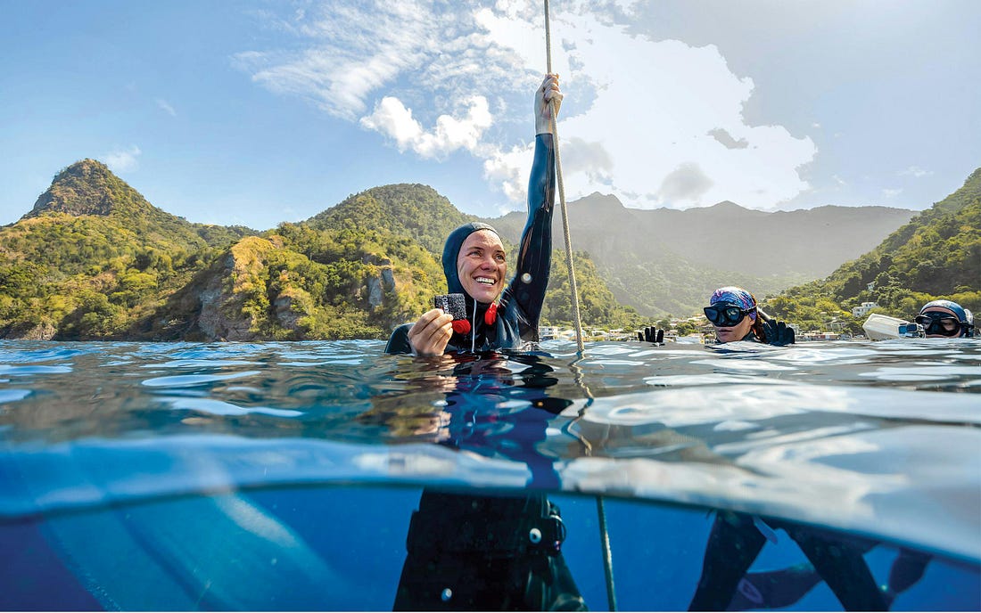 photo of burnett holding tag in water