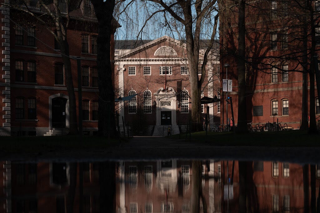 A building on Harvard's campus is seen through trees.