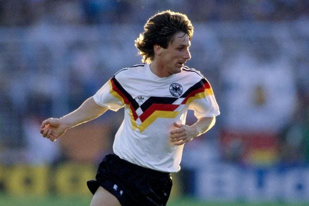 An image collage containing 1 images, Image 1 shows Frank Mill of West Germany dribbling the ball during a soccer game