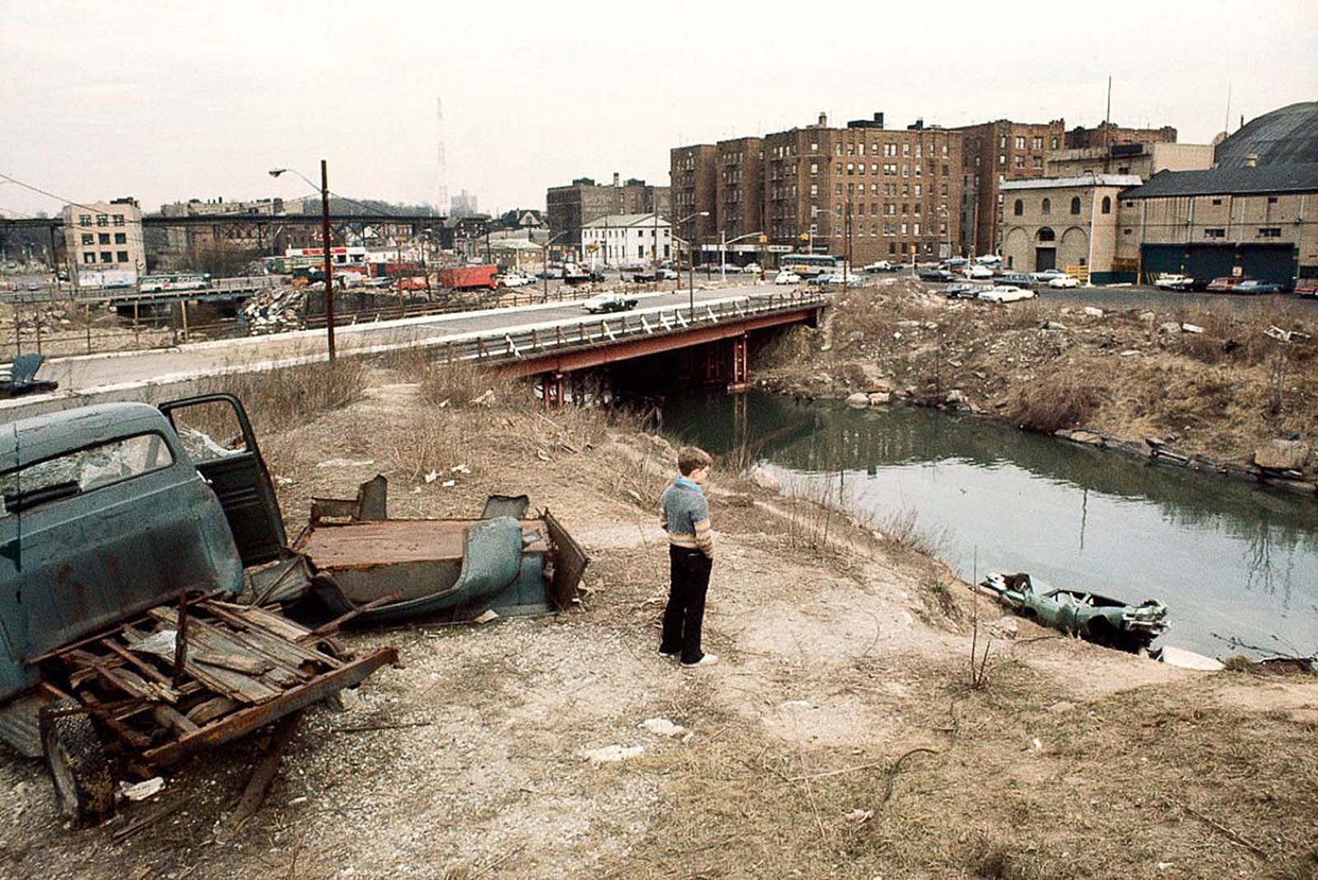 The stark contrast of old architecture and new street art defines 1970s NYC's aesthetic. The stark contrast of old architecture and new street art defines 1970s NYC's aesthetic.
