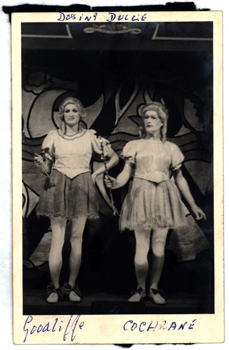 The pantomime Dossing Dulcie, with Michael Goodliffe (left) as an Immoral Fairy and Brodie Cochrane (right) as a Moral Fairy. The image shows two men in skirts that look like limp tutus and reach mid-thigh, exposing their knobbly knees