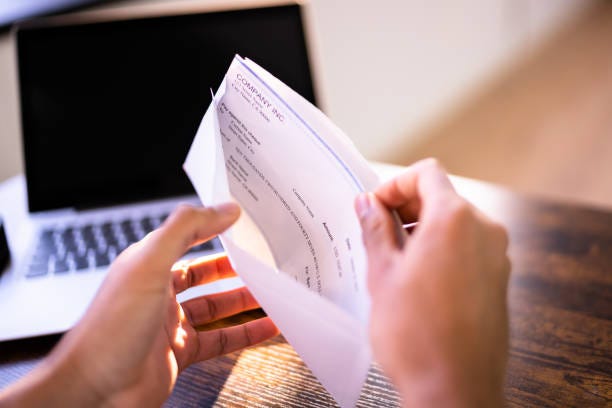 Payroll Cheque In Envelope Payroll Cheque In Envelope. Man Hand Holding Paycheck payroll stock pictures, royalty-free photos & images Payroll Cheque In Envelope Payroll Cheque In Envelope. Man Hand Holding Paycheck payroll stock pictures, royalty-free photos & images