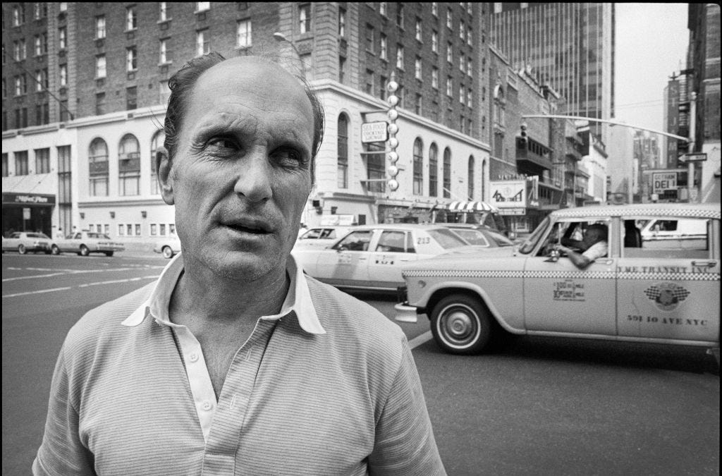 Robert Duvall on stage in a production, in character and mid-performance
