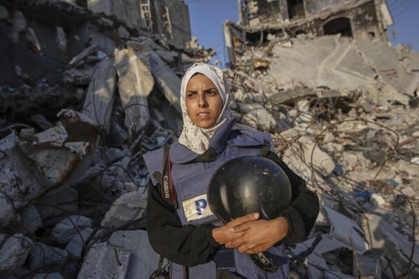 Freelance journalist Mariam Dagga, 33, who had been working with the Associated Press and other outlets since the start of the Gaza war, poses for a portrait in Khan Younis, southern Gaza Strip, June 14, 2024. She was among at least 19 people, including at least four journalists, killed Monday in an Israeli strikes on Nasser Hospital in Khan Younis. (AP Photo/Jehad Alshrafi) Freelance journalist Mariam Dagga, 33, who had been working with the Associated Press and other outlets since the start of the Gaza war, poses for a portrait in Khan Younis, southern Gaza Strip, June 14, 2024. She was among at least 19 people, including at least four journalists, killed Monday in an Israeli strikes on Nasser Hospital in Khan Younis. (AP Photo/Jehad Alshrafi)