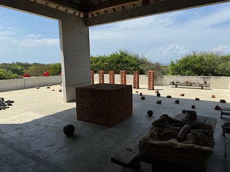 A gallery of images showing art by Bosco Sodi, mostly a collection of concrete and bricks.