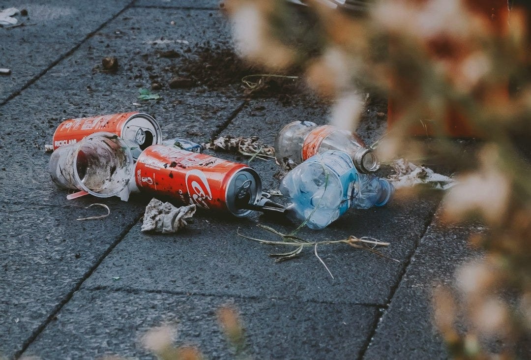 a group of toy figures on a sidewalk a group of toy figures on a sidewalk