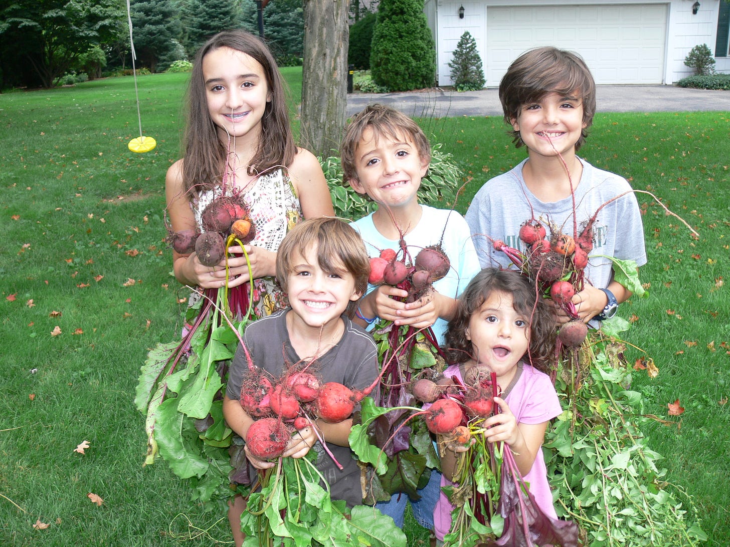 kids posing with just-picked beets