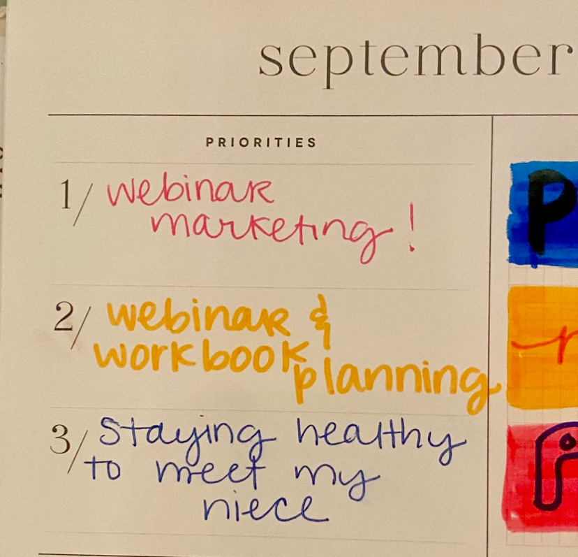 My monthly priorities written out as: 1. webinar marketing, 2. webinar planning, 3. staying healthy to meet my niece