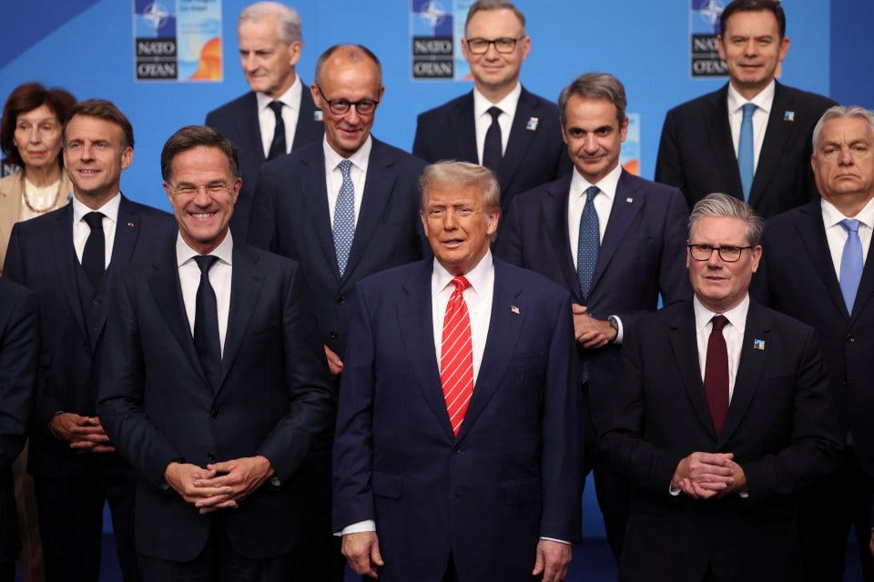 President Trump with NATO leaders at a summit.