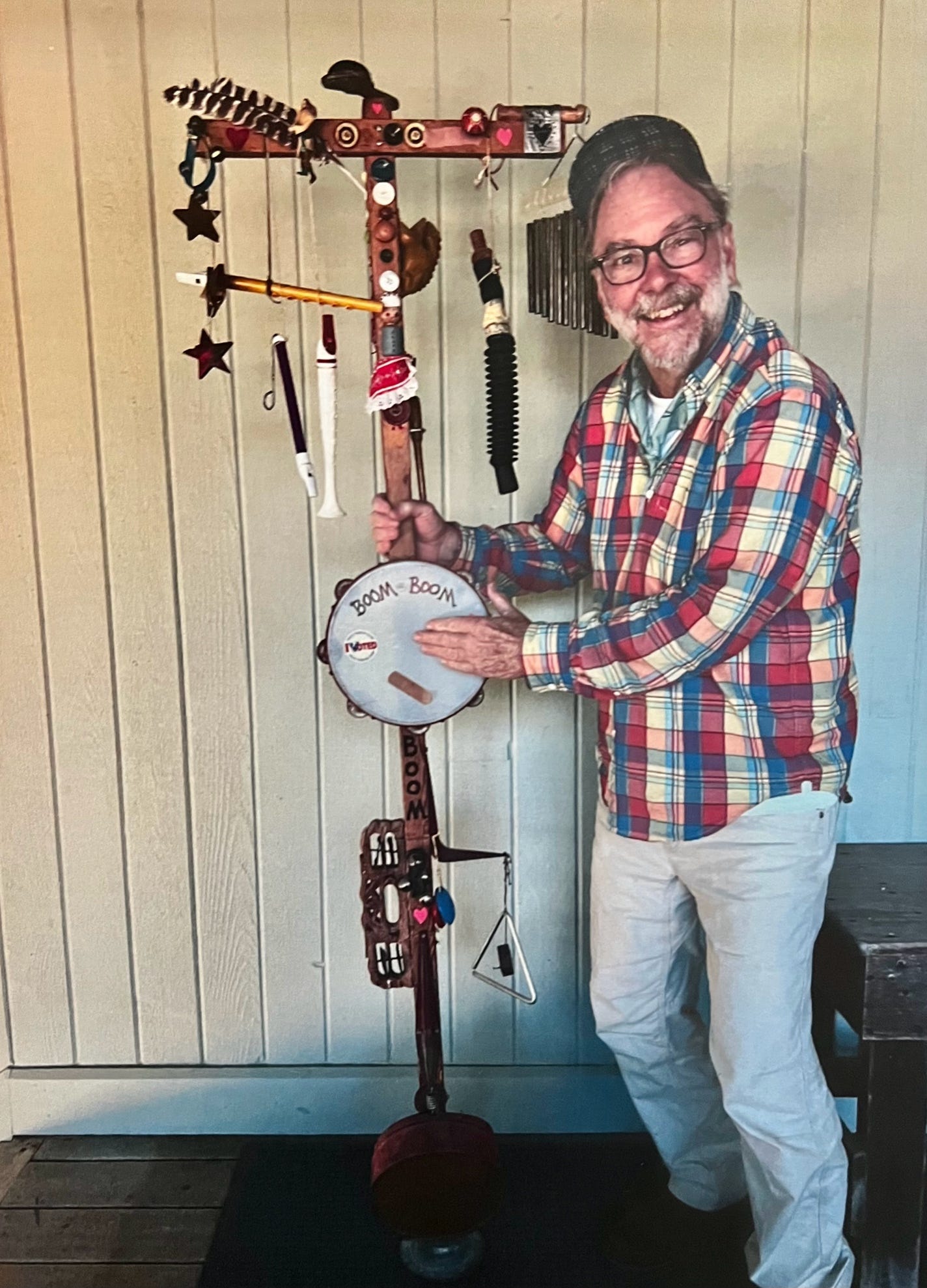 A person holding a drum

AI-generated content may be incorrect.
