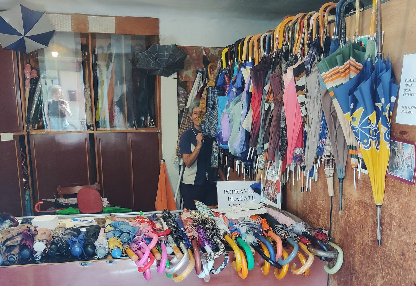 Lah in her Dežnik umbrella repair shop - Ljubljana, Slovenia