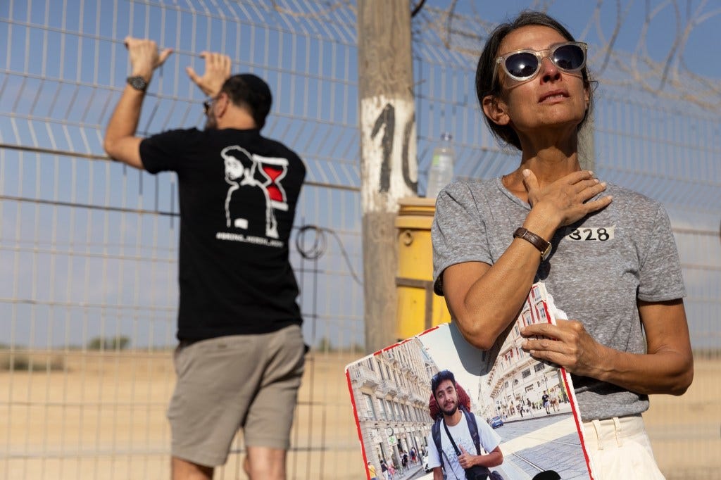 Rachel Goldberg, mother of hostage Hersh Goldberg-Polin, holds his photo while protesting near the Gaza Strip border.