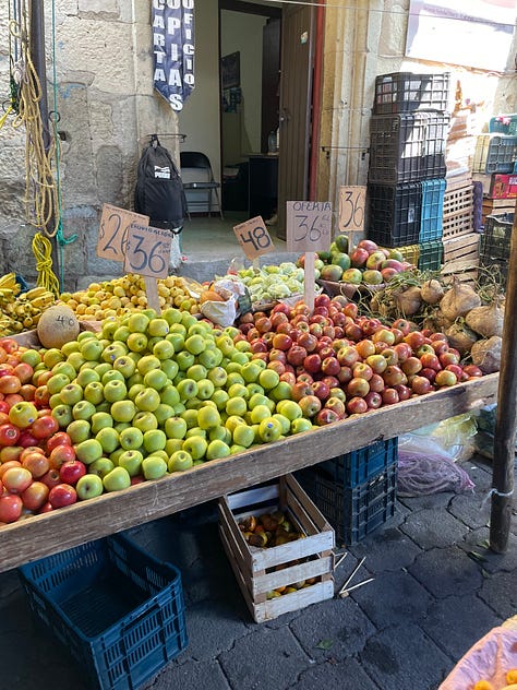 A collage showing fruit and vegetables for sale at the Etla market.