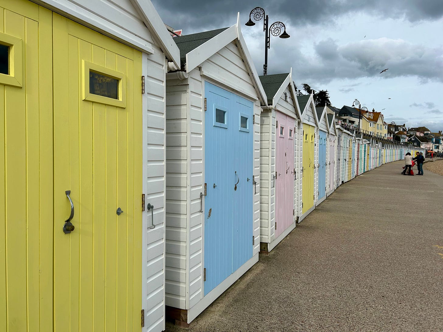 A row of brightly coloured beach huts at Lyme Regis. A row of brightly coloured beach huts at Lyme Regis.