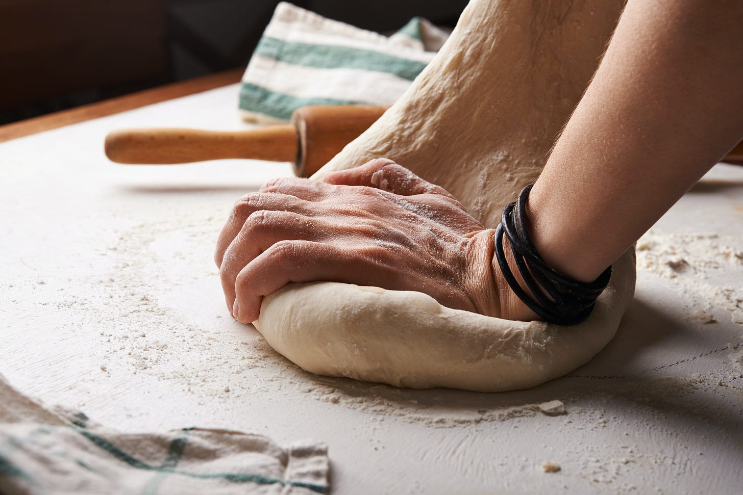 Man kneading dough