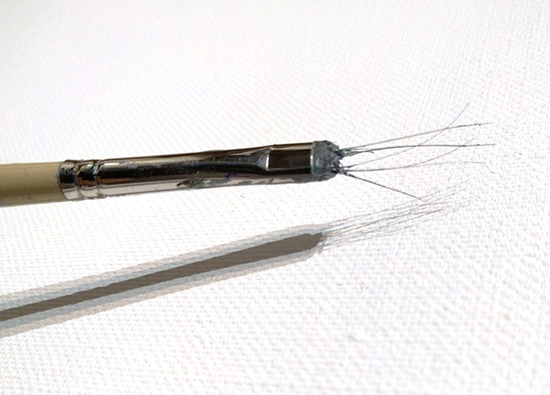 Photograph of Thomas Paquette Painting Brush