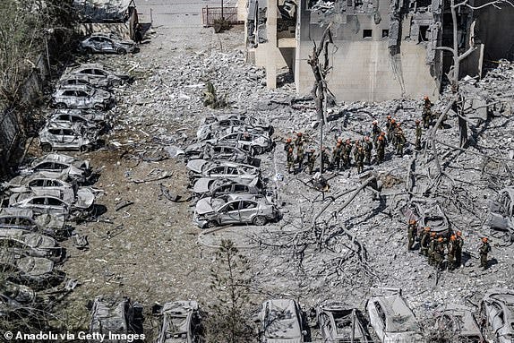 BEERSHEBA, ISRAEL - JUNE 24: Search and rescue efforts continue in the seven-story building that was partially collapsed and hit by a ballistic missile fired from Iran shortly before the ceasefire announced by US President Donald Trump came into effect in Beersheba, Israel on June 24, 2025. There were reported deaths and injuries in the attack. A ceasefire between Israel and Iran came into effect at 0400GMT Tuesday following hours of intensified mutual hostilities. (Photo by Mostafa Alkharouf/Anadolu via Getty Images)