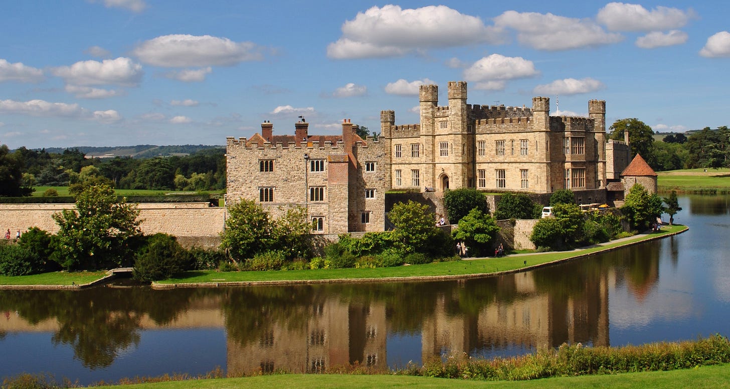 Part of Leeds Castle, mirrored in its lake-cum-moat Part of Leeds Castle, mirrored in its lake-cum-moat