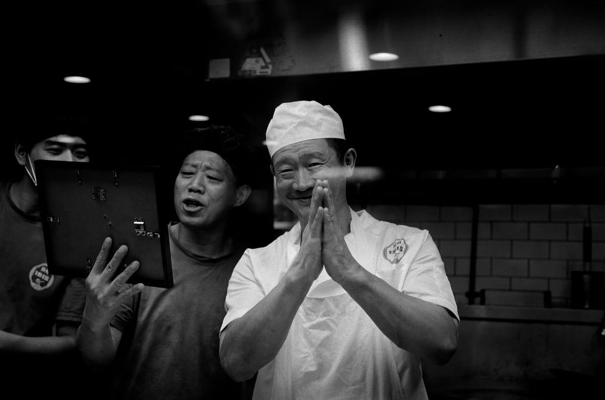 Chefs looking to my printed and framed picture.