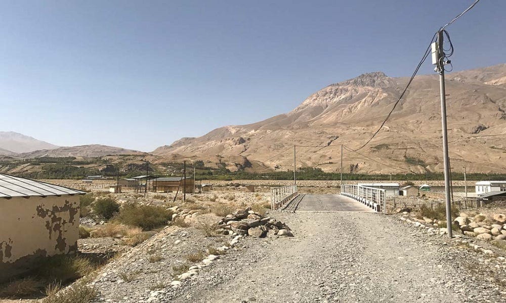 A picture containing outdoor, sky, ground, mountain

Description automatically generated