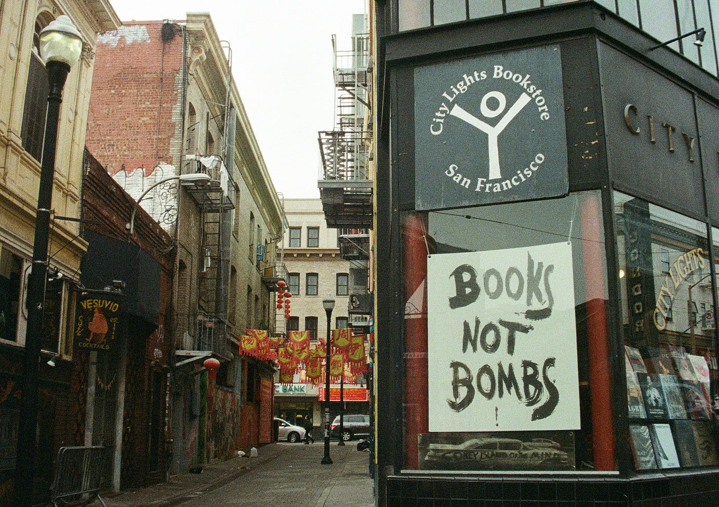 An image of the exterior of San Francisco's City Lights Bookstore, with the sign "Books Not Bombs." An image of the exterior of San Francisco's City Lights Bookstore, with the sign "Books Not Bombs."