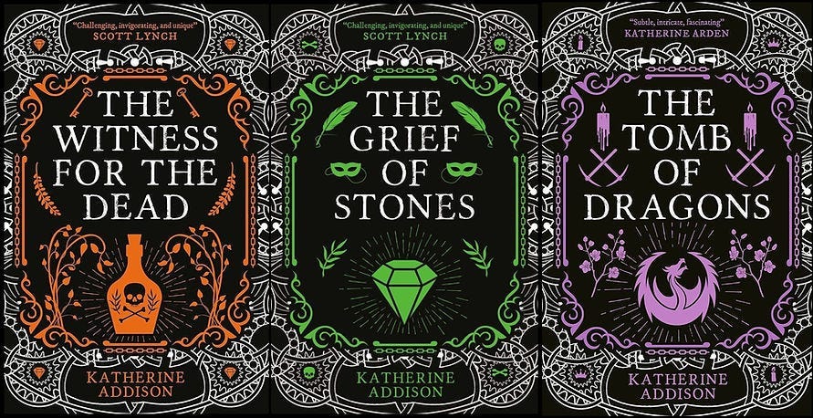 Three ornate book covers, featuring “The Witness for the Dead,” “The Grief of Stones,” and “The Tomb of Dragons” by Katherine Addison.