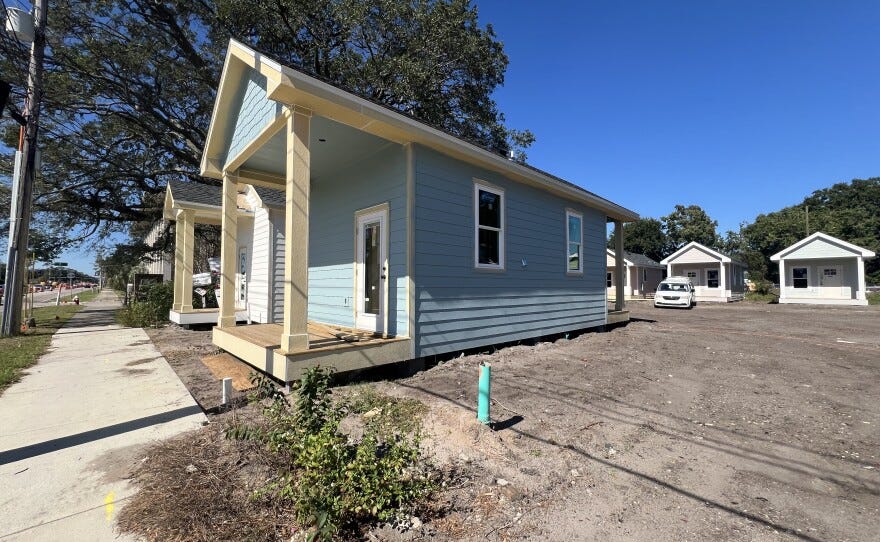Along Garden Street in downtown Pensacola, Trinity Village’s row of tiny homes reflects a growing local push to create affordable, permanent housing. Along Garden Street in downtown Pensacola, Trinity Village’s row of tiny homes reflects a growing local push to create affordable, permanent housing.