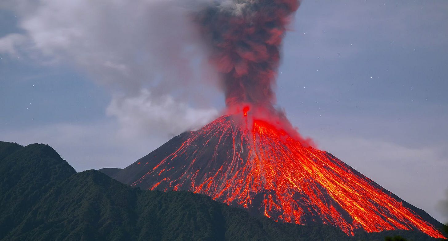 Reventador Volcano erupting at night