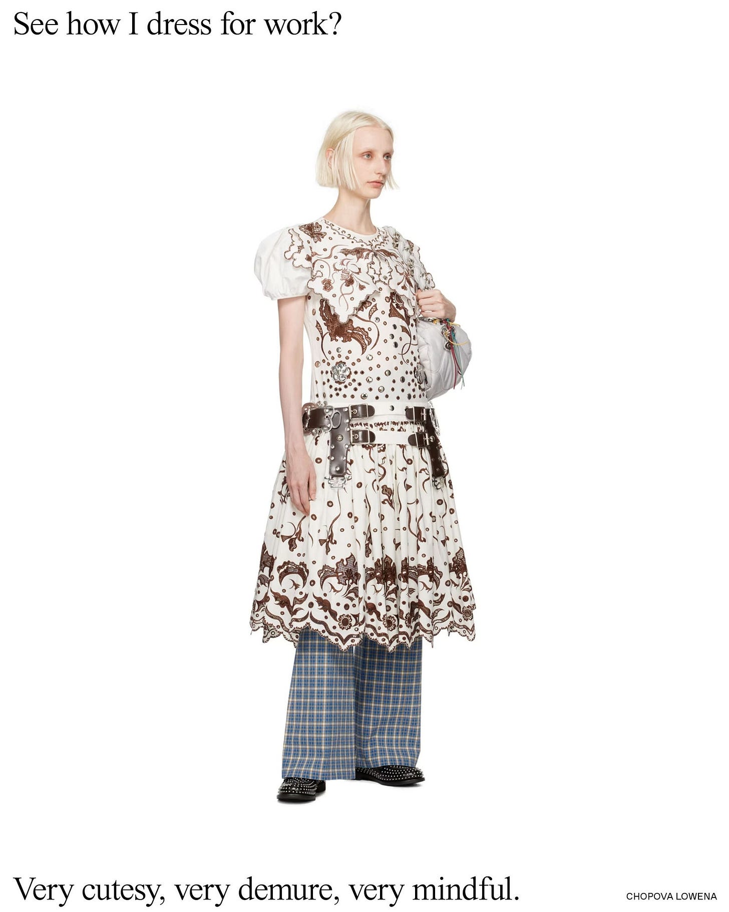 A pale-skinned blonde model wearing a jumble of mismatched clothing from designer Chopova Lowena A pale-skinned blonde model wearing a jumble of mismatched clothing from designer Chopova Lowena