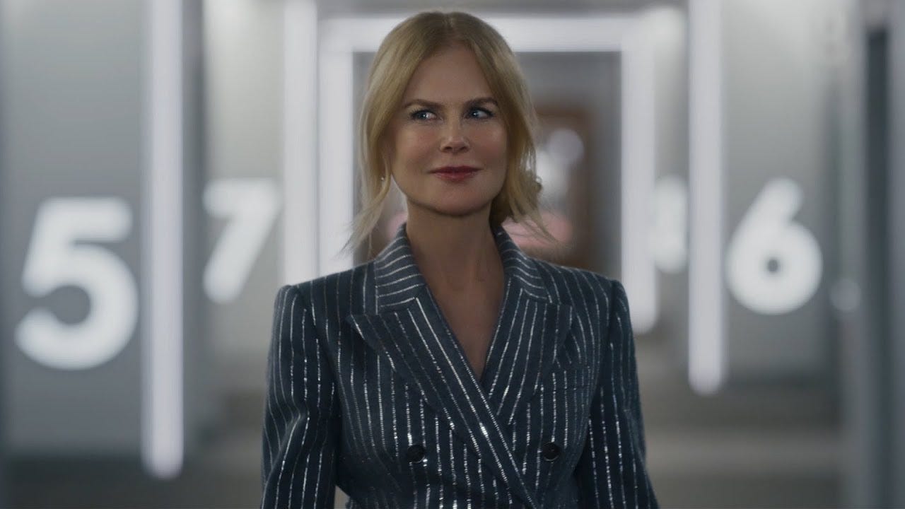 A still of Nicole Kidman walking through an AMC theater.