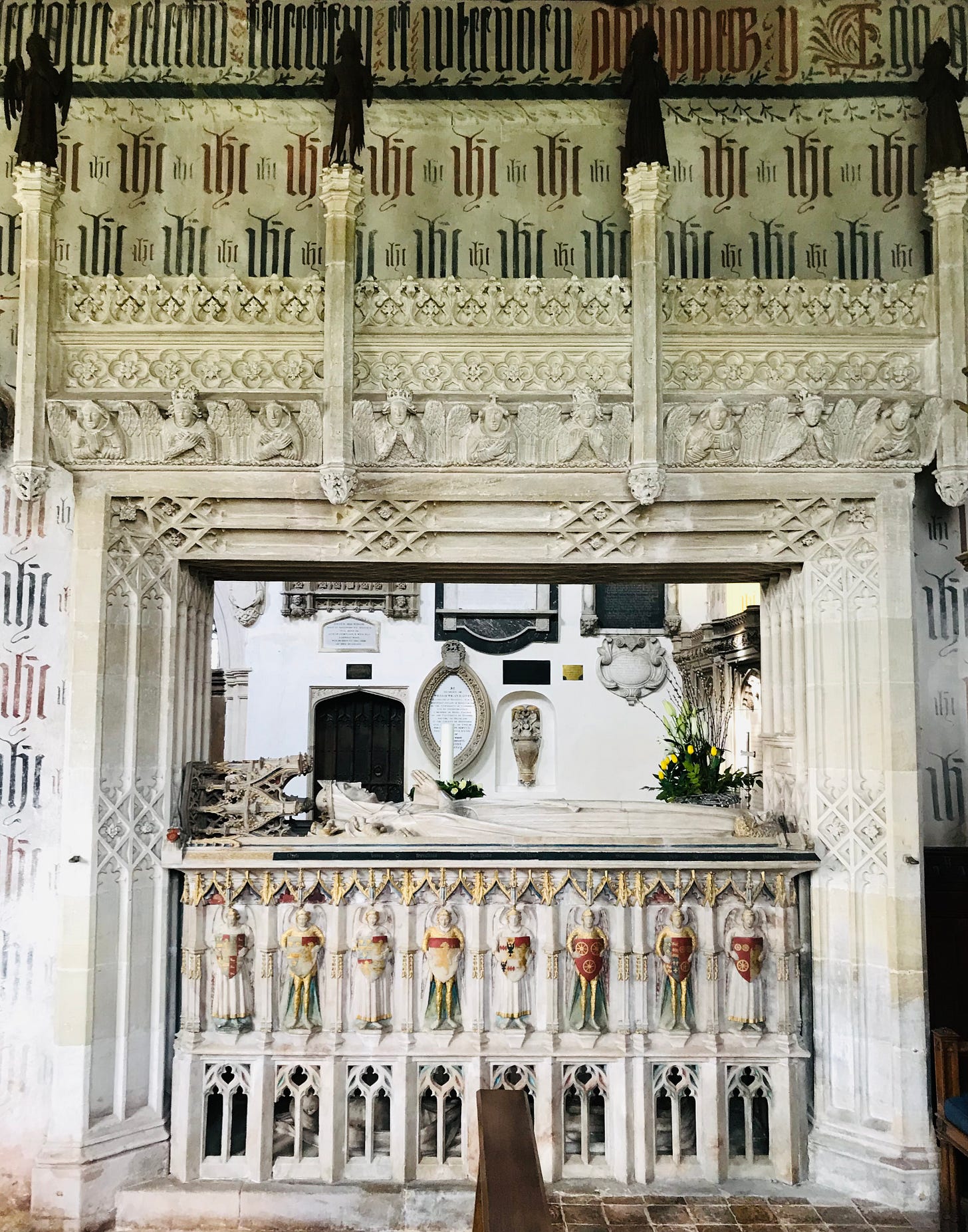 Arranged over three levels, from the most elaborate and celebratory at the top to the realistic effigy of the occupant in her funeral shroud at the very bottom. 