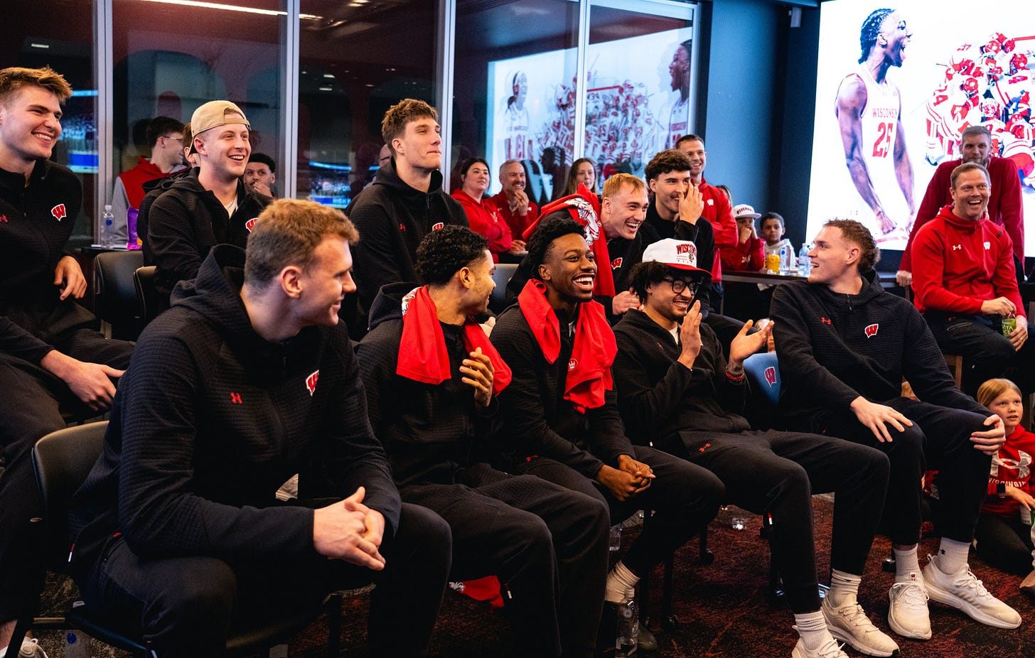 Wisconsin Badgers players sit together watching the NCAA Tournament Selection Show on Selection Sunday. Photo credit: UW Athletics. Wisconsin Badgers players sit together watching the NCAA Tournament Selection Show on Selection Sunday. Photo credit: UW Athletics.