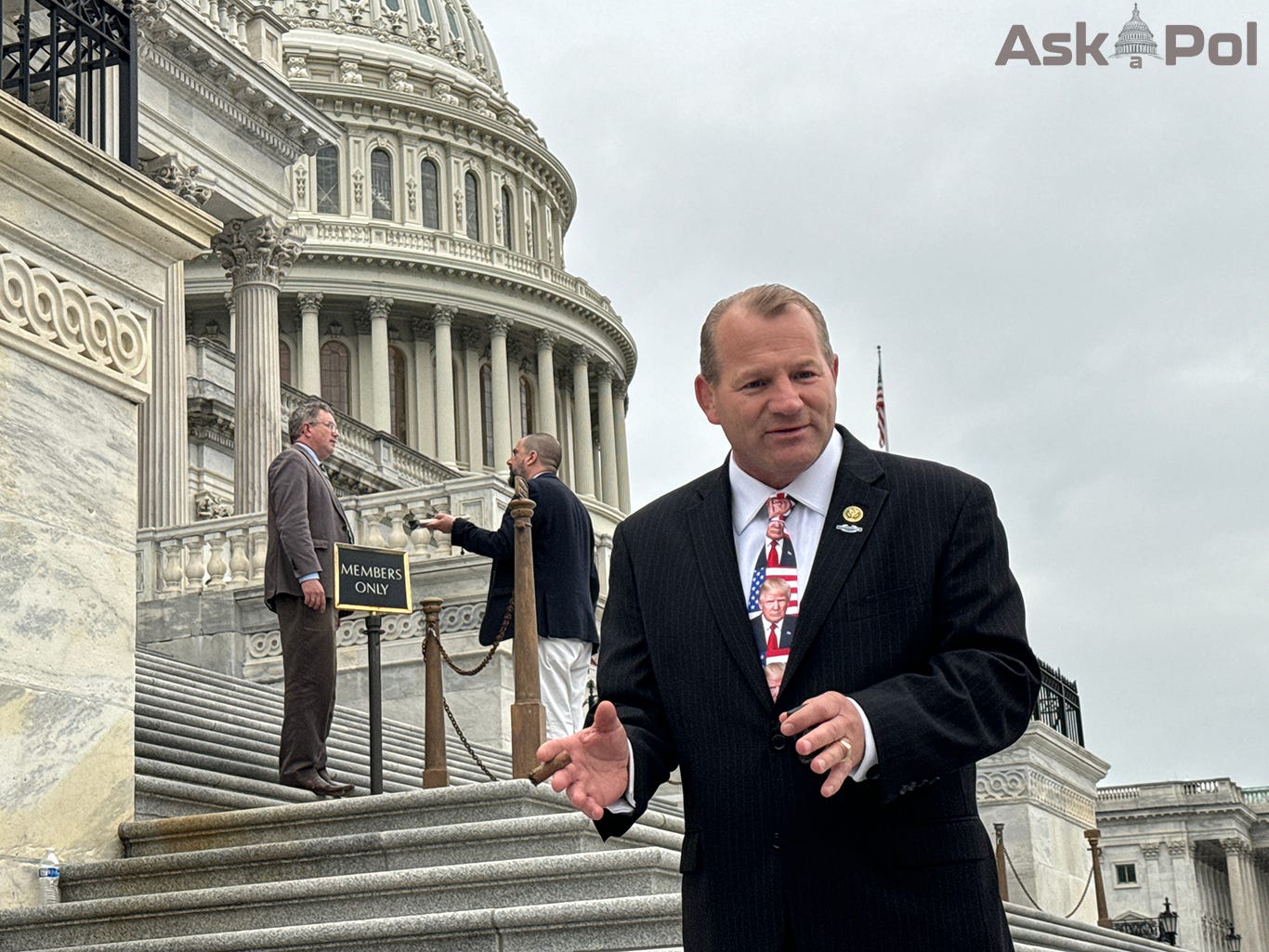 Politicians answer reporters questions on the marble steps of the US Capitol 