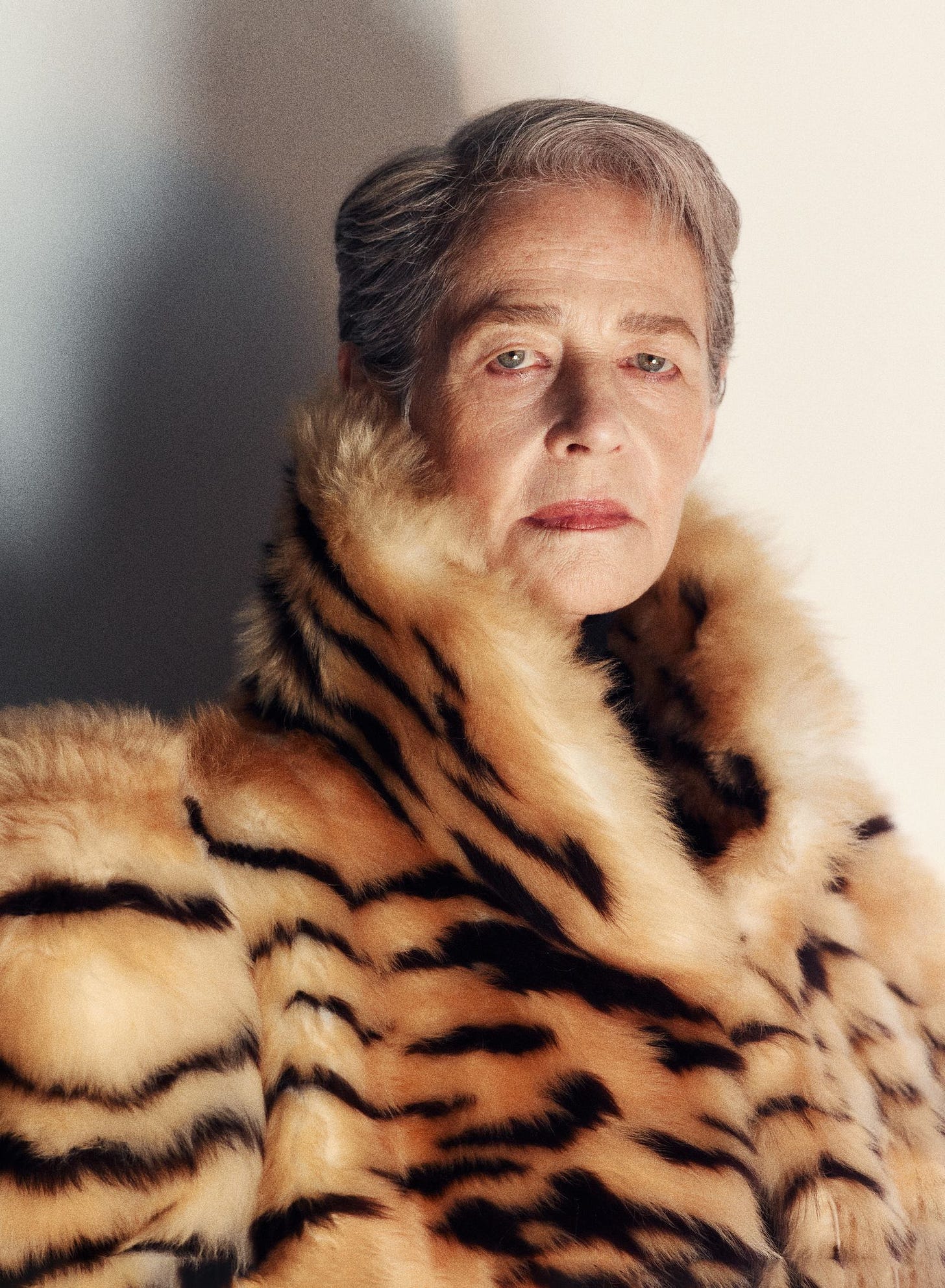 Image may contain Charlotte Rampling Face Head Person Photography Portrait Clothing Fur Animal Mammal and Tiger