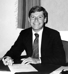 Lee at a desk