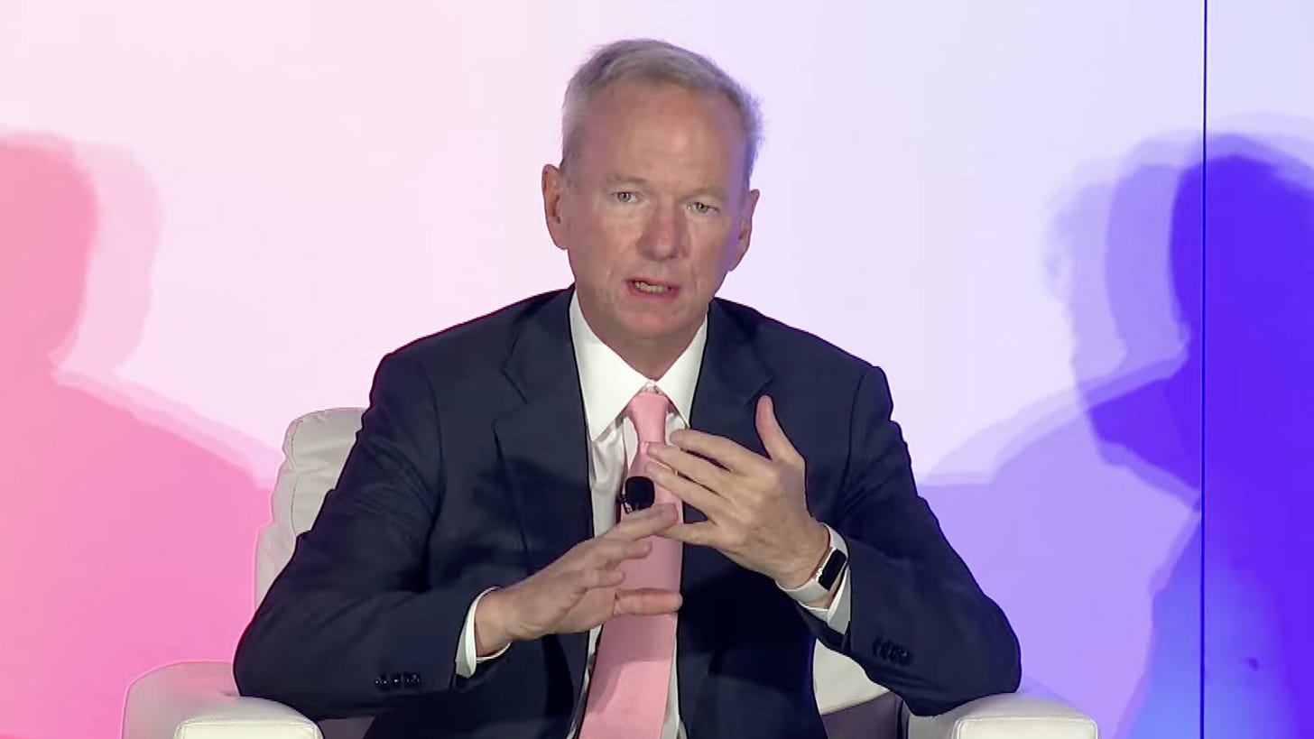 Eric Schmidt sitting in a chair on stage Eric Schmidt sitting in a chair on stage