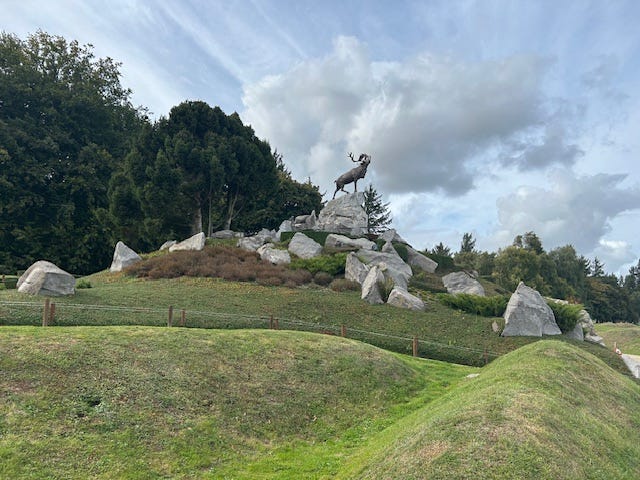 May be an image of grass and Stone Henge May be an image of grass and Stone Henge
