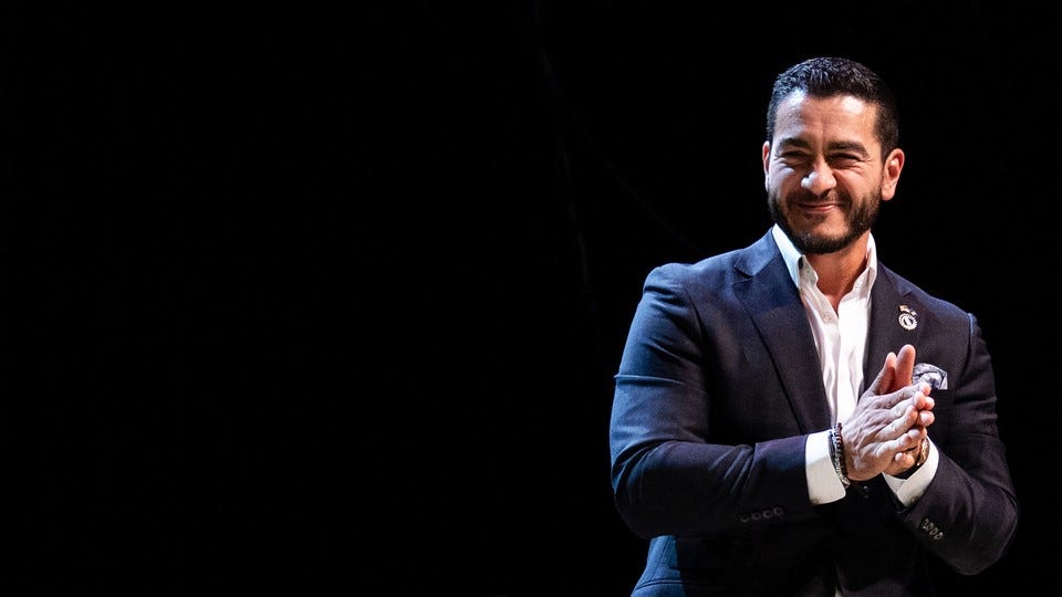 Photograph of El-Sayed smiling against a black background