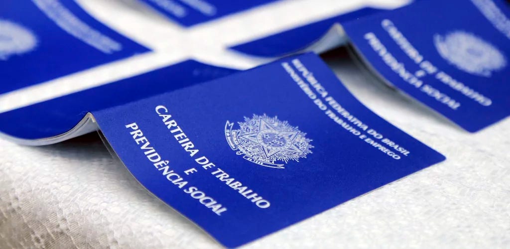 Four work cards open and upside down, with their front section upwards.