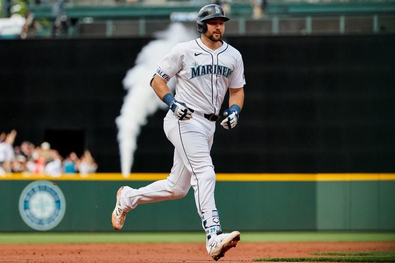 Mariners catcher Cal Raleigh rounds the bases after hitting a home run on June 17. (Jennifer Buchanan / The Seattle Times)
