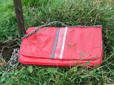 A dress, a handbag and a top with dye and paint treatments.