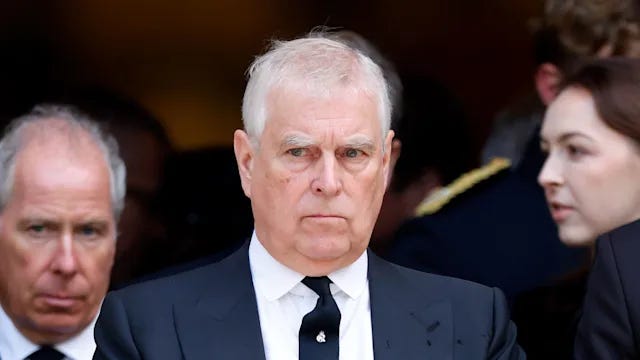 Prince Andrew in a suit looking serious