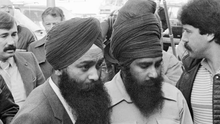 Inderjit Singh Reyat, left, and Talwinder Singh Parmar are shown at the courthouse in Duncan, B.C., on Nov. 8, 1985. (Chuck Stoody/Canadian Press)