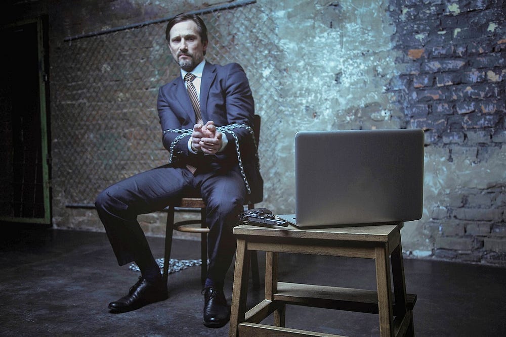 A businessman chained up A businessman chained up