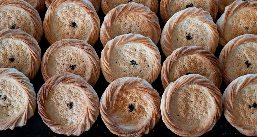 a bunch of breads that are sitting on a table