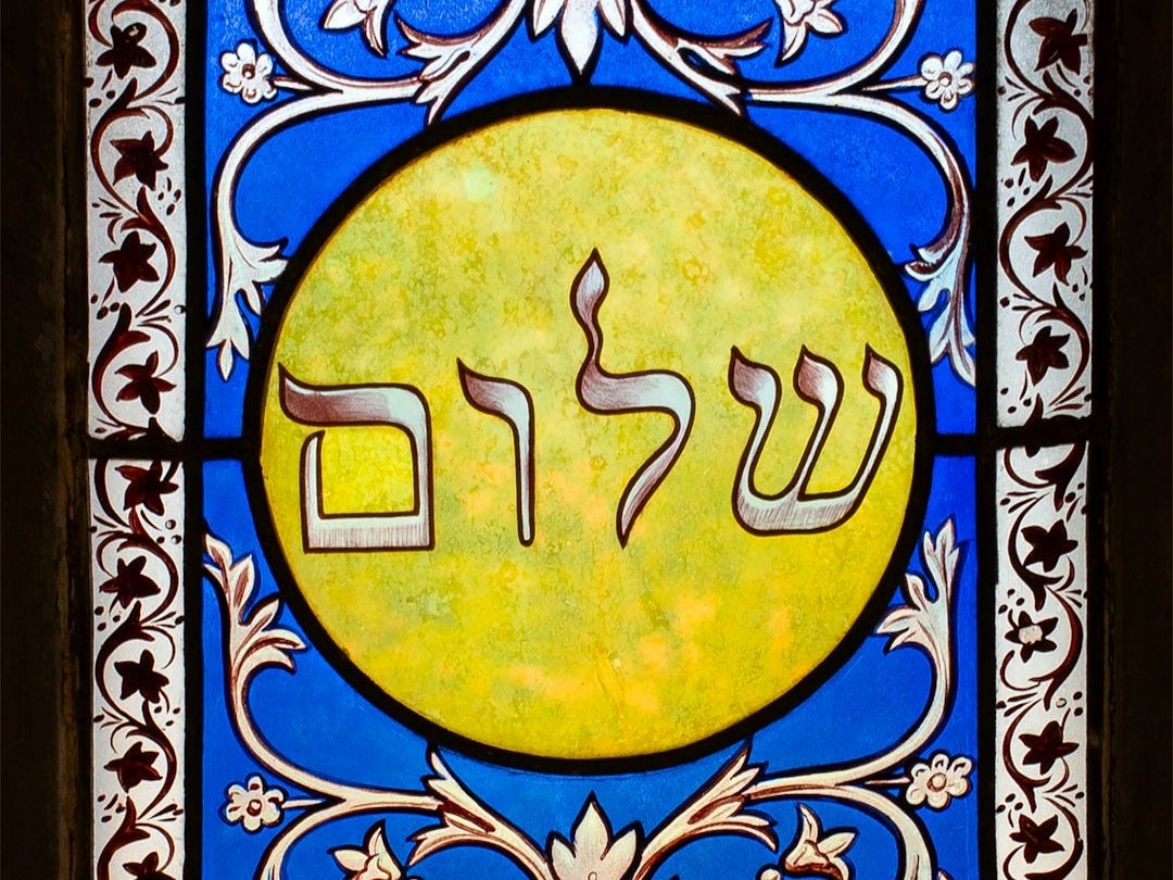 a stained glass window with a picture of a man on it