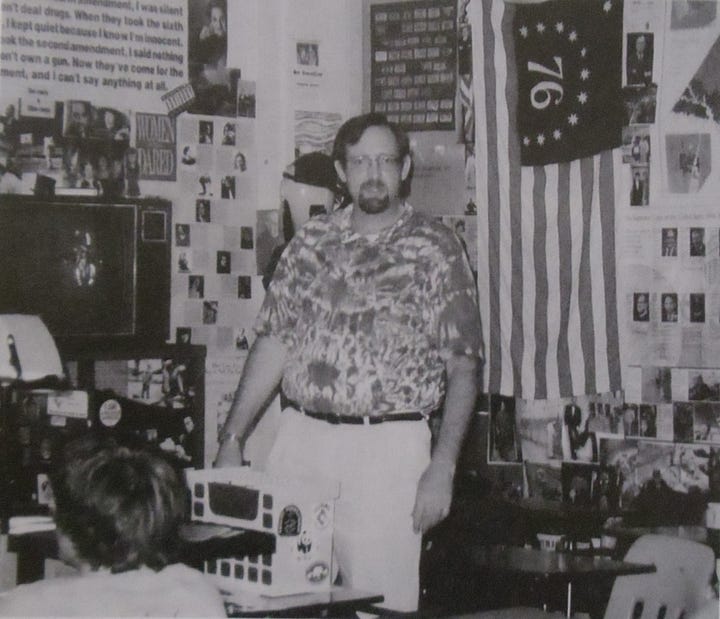 Duke Stableford (left, in his classroom at Chancellor High School in 2002) created 30 needlepoint interpretations of Marvel comic book covers (right, photo credit Karen Pearlman). They will be on display at UMW this evening before author Bob Batchelor's Great Lives lecture on Marvel Comics creator Stan Lee. Photos courtesy UMW.