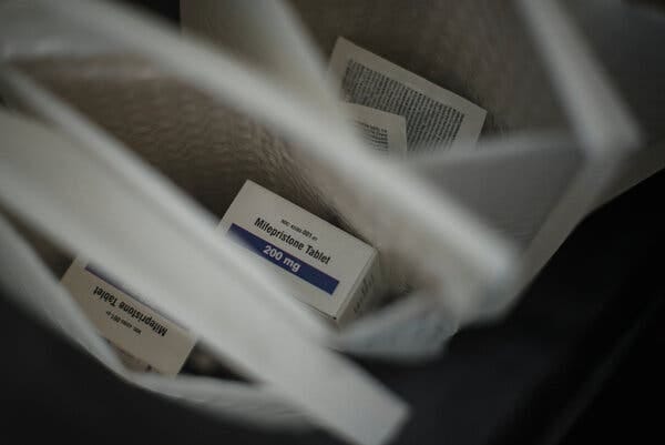 Mailing pouches with boxes of the abortion pill mifepristone inside.