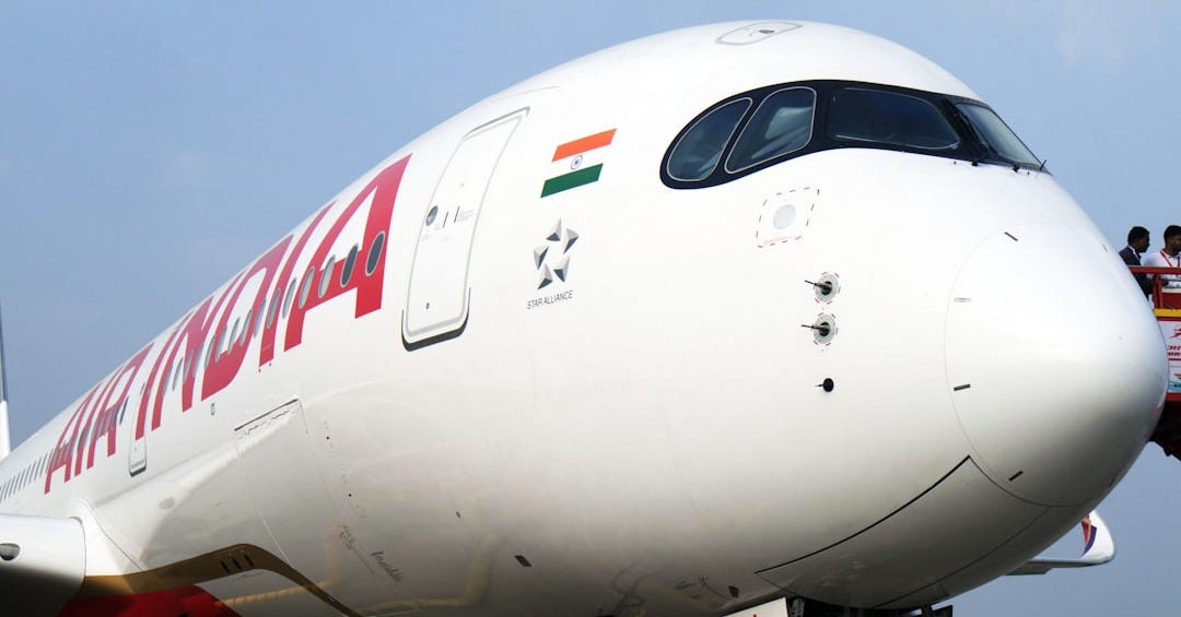 A large jetliner sitting on top of an airport tarmac